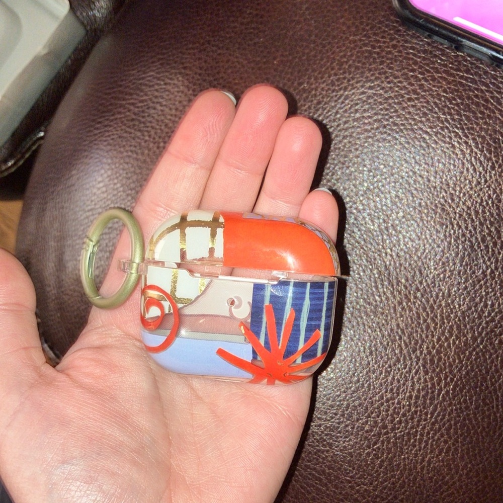 Colorfully designed generation three AirPod Case on keychain.